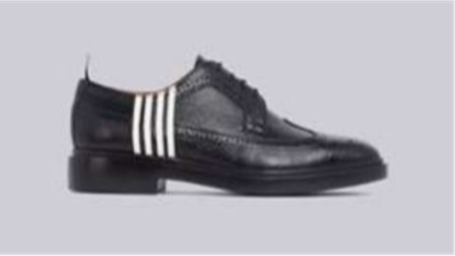 A black shoe with white stripes

Description automatically generated